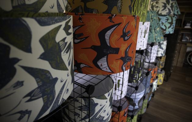 Lampshades on shelves in shop